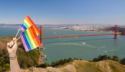 Image showing hand with gay pride rainbow flags and wristband