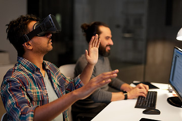 Image showing creative man in virtual reality headset at office