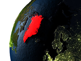 Image showing Greenland in red on Earth at night