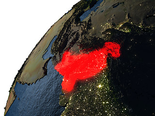 Image showing Pakistan in red on Earth at night