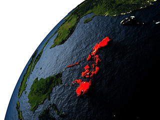 Image showing Philippines in red on Earth at night