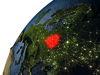 Image showing Belarus in red on Earth at night