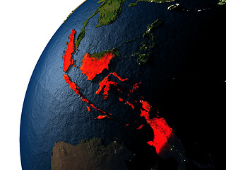 Image showing Indonesia in red on Earth at night