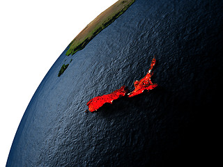 Image showing New Zealand in red on Earth at night