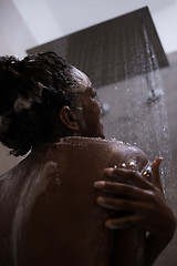 Image showing African American woman in the shower