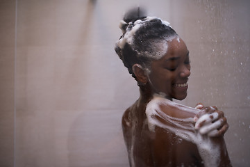 Image showing African American woman in the shower