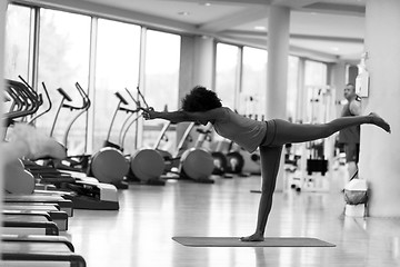 Image showing african american woman exercise yoga in gym