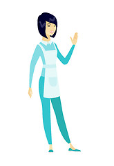 Image showing Young asian cleaner waving her hand.