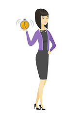 Image showing Asian business woman holding alarm clock.