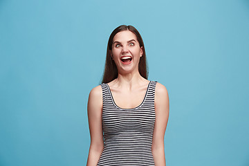 Image showing The squint eyed woman with weird expression isolated on blue