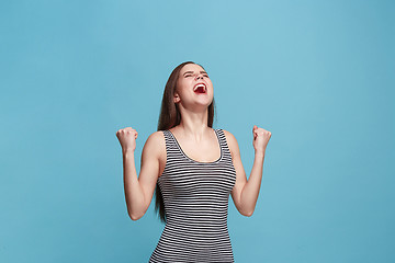 Image showing Winning success woman happy ecstatic celebrating being a winner. Dynamic energetic image of female model