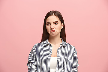 Image showing Beautiful woman looking suprised and bewildered isolated on pink