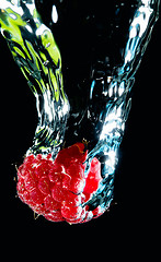 Image showing Fresh berry falling in water