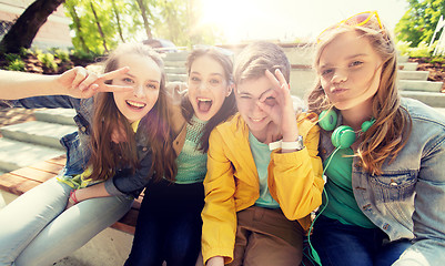 Image showing happy teenage students or friends having fun