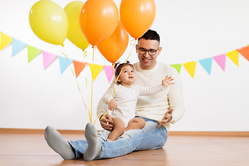 Image showing father and daughter with birthday party balloons