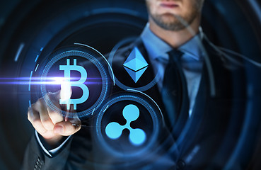 Image showing businessman with at cryptocurrency icons