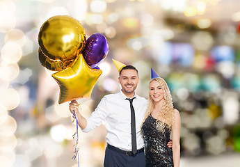 Image showing happy couple with balloons over party lights