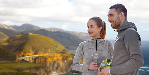 Image showing couple of sportsmen with water over big sur coast