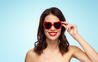 Image showing woman with red lipstick and heart shaped shades