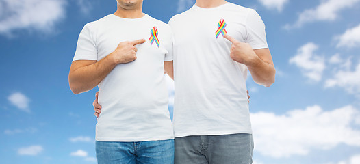 Image showing close up of couple with gay pride rainbow ribbons