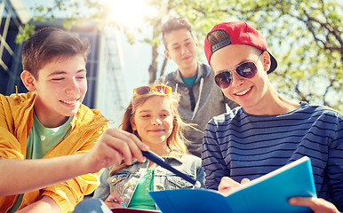 Image showing group of students with notebooks at school yard