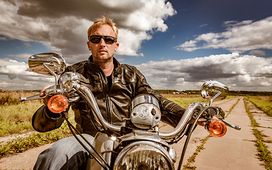 Image showing Biker on a motorcycle