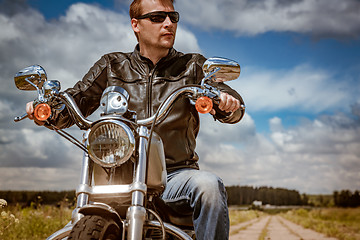 Image showing Biker on a motorcycle