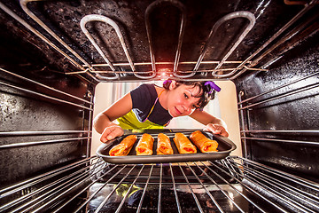 Image showing Cooking in the oven at home.