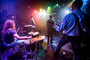 Image showing Band performs on stage in a nightclub