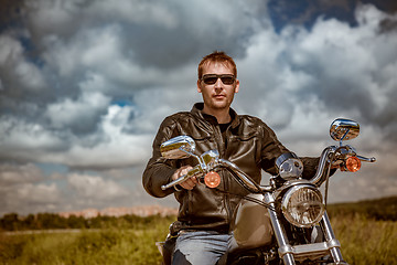 Image showing Biker on a motorcycle