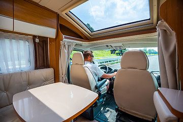 Image showing Man driving on a road in the Camper Van RV