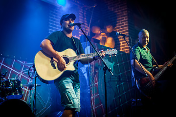 Image showing Band performs on stage in a nightclub