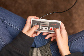 Image showing Nintengo NES,playing Super Mario 3