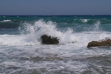 Image showing Waves beating rocks on greek island