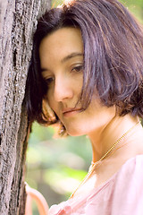 Image showing unhappy woman near the tree