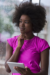 Image showing african american woman using tablet