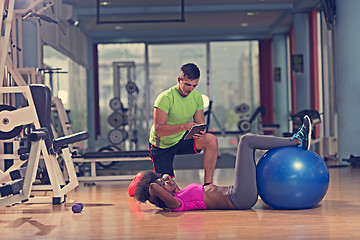 Image showing pilates  workout with personal trainer at gym