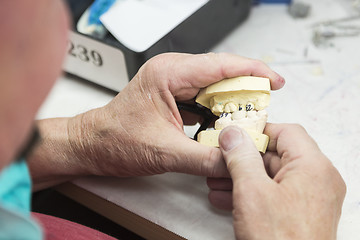 Image showing Dental Technician Working On 3D Printed Mold For Tooth Implants