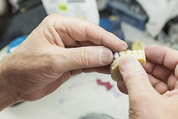 Image showing Dental Technician Working On 3D Printed Mold For Tooth Implants