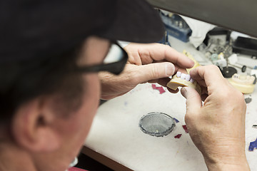 Image showing Dental Technician Working On 3D Printed Mold For Tooth Implants