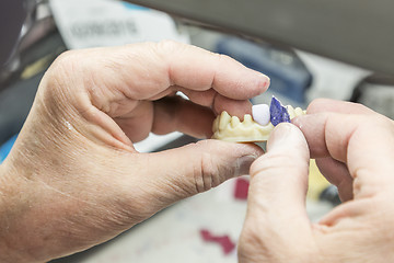 Image showing Dental Technician Working On 3D Printed Mold For Tooth Implants