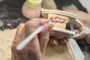 Image showing Dental Technician Applying Porcelain To 3D Printed Implant Mold