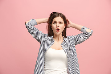 Image showing Beautiful woman in stress isolated on pink