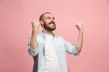 Image showing Winning success man happy ecstatic celebrating being a winner. Dynamic energetic image of male model