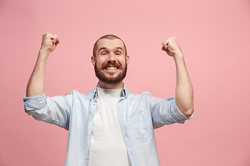 Image showing Winning success man happy ecstatic celebrating being a winner. Dynamic energetic image of male model