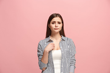 Image showing Beautiful woman looking suprised and bewildered isolated on pink