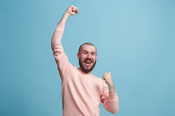 Image showing Winning success man happy ecstatic celebrating being a winner. Dynamic energetic image of male model