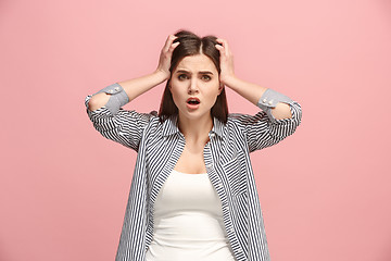 Image showing Beautiful woman in stress isolated on pink