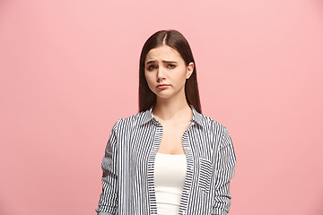 Image showing Beautiful woman looking suprised and bewildered isolated on pink