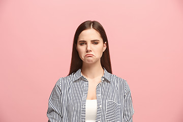 Image showing Beautiful woman looking suprised and bewildered isolated on pink